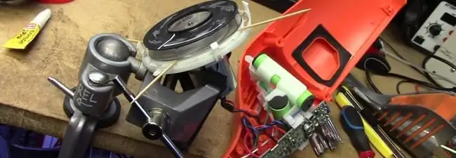 Vacuum cleaner repair parts and tools on a workbench in Little Rock, AR